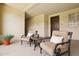 Inviting covered balcony with seating and a view of the neighborhood at 17850 N 68Th St # 2138, Phoenix, AZ 85054