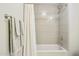 Bathroom features a bathtub with white shower curtain and tile surround at 17850 N 68Th St # 2138, Phoenix, AZ 85054