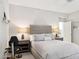 Bright bedroom featuring a comfortable queen bed, nightstands with lamps, and a ceiling fan at 17850 N 68Th St # 2138, Phoenix, AZ 85054