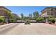 Gated community entrance featuring lush landscaping, elegant brickwork, and stately architecture at 17850 N 68Th St # 2138, Phoenix, AZ 85054