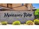 Stone sign displaying 'Monterey Ridge' with manicured bushes and neutral colored building in background at 17850 N 68Th St # 2138, Phoenix, AZ 85054