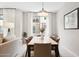 Bright dining room with modern table, stylish chairs, and large window offering abundant natural light at 17850 N 68Th St # 2138, Phoenix, AZ 85054