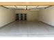 A well-lit garage featuring epoxy floors and storage racks at 17850 N 68Th St # 2138, Phoenix, AZ 85054