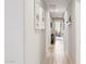 Inviting hallway with neutral walls, modern flooring, and access to various rooms and balcony at 17850 N 68Th St # 2138, Phoenix, AZ 85054