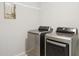 Laundry room featuring modern, stainless steel washer and dryer units at 17850 N 68Th St # 2138, Phoenix, AZ 85054