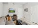 Stylish living room featuring a TV and comfortable gray sofa at 17850 N 68Th St # 2138, Phoenix, AZ 85054