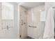 Walk-in shower with sleek tile, grab bars, and clear glass, offering accessibility and natural light at 17850 N 68Th St # 2138, Phoenix, AZ 85054