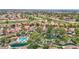 Stunning aerial view of the neighborhood, showcasing the golf course and community amenities at 19107 N 94Th Ave, Peoria, AZ 85382