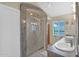 Bathroom with a large granite shower stall, dual sinks and tasteful decor at 19107 N 94Th Ave, Peoria, AZ 85382