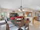 Open dining room featuring pendant lighting and views into the kitchen and living areas at 19107 N 94Th Ave, Peoria, AZ 85382