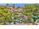 Lush community landscaping with mature trees, colorful flowerbeds, and peaceful water features at 19107 N 94Th Ave, Peoria, AZ 85382