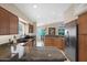 Spacious kitchen with granite countertops, stainless steel appliances and wood cabinets at 19107 N 94Th Ave, Peoria, AZ 85382