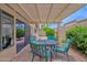 Outdoor patio featuring a pergola, comfortable seating and beautiful landscaping at 19107 N 94Th Ave, Peoria, AZ 85382