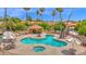 Inviting community pool and hot tub area surrounded by lush landscaping and comfortable seating at 19107 N 94Th Ave, Peoria, AZ 85382