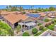 Charming patio area with pergola, lovely seating, and desert landscaping; perfect for outdoor entertaining at 19107 N 94Th Ave, Peoria, AZ 85382