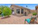 Backyard patio featuring a brick surface, barbecue, desert landscaping, and a relaxing fountain at 19107 N 94Th Ave, Peoria, AZ 85382