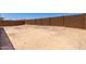 A large empty backyard provides ample space for creativity at 20256 W Monterey Way, Buckeye, AZ 85396