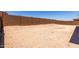 A large empty backyard provides ample space for creativity at 20256 W Monterey Way, Buckeye, AZ 85396