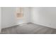 This carpeted bedroom features natural light and neutral tones at 20256 W Monterey Way, Buckeye, AZ 85396