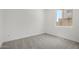 This bedroom has carpet flooring and a large window at 20256 W Monterey Way, Buckeye, AZ 85396