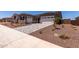 Lovely home with a two-car garage, paver driveway, and desert landscaping at 20256 W Monterey Way, Buckeye, AZ 85396