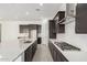 Bright kitchen with a gas range and subway tile backsplash, ample storage space and a center island at 20256 W Monterey Way, Buckeye, AZ 85396