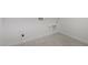 This laundry room features tile flooring and hookups at 20256 W Monterey Way, Buckeye, AZ 85396