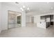 Open concept living area featuring tile floors, recessed lighting, and sliding glass doors to the patio at 20256 W Monterey Way, Buckeye, AZ 85396