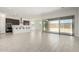Open-concept living area with tile floors, recessed lighting, and plenty of natural light at 20256 W Monterey Way, Buckeye, AZ 85396