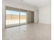 Bright living area with sliding glass doors and tile floors offering seamless indoor/outdoor living at 20256 W Monterey Way, Buckeye, AZ 85396