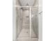 A modern stand up shower with neutral color tile walls, glass doors, and duel shower heads at 20256 W Monterey Way, Buckeye, AZ 85396