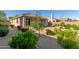 Well-maintained backyard with gravel, desert landscaping, and a covered patio, enhancing the home's outdoor appeal at 20783 W Pasadena Ave, Buckeye, AZ 85396