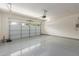 Spacious two-car garage with neutral paint and epoxy floor, great for storage or a workshop space at 20783 W Pasadena Ave, Buckeye, AZ 85396
