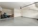 Bright, clean garage with epoxy flooring, water heater, and room for storage, plus garage door opener at 20783 W Pasadena Ave, Buckeye, AZ 85396