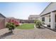 Beautifully landscaped backyard featuring artificial turf and decorative plants, perfect for relaxing and entertaining at 22964 E Via Del Sol --, Queen Creek, AZ 85142