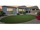Backyard featuring a lush green lawn, desert landscaping, and a covered patio for relaxing outdoor living at 22964 E Via Del Sol --, Queen Creek, AZ 85142