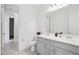 Bathroom features a double sink vanity with modern fixtures and a separate toilet room at 22964 E Via Del Sol --, Queen Creek, AZ 85142