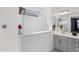 Bathroom showcasing a glass-enclosed shower, double sink vanity, and modern lighting fixtures at 22964 E Via Del Sol --, Queen Creek, AZ 85142