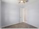 Cozy bedroom features neutral carpet, ceiling fan, and door to another room at 22964 E Via Del Sol --, Queen Creek, AZ 85142