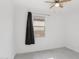 Bright bedroom showcasing a window with a sleek, black curtain at 22964 E Via Del Sol --, Queen Creek, AZ 85142