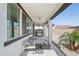Inviting covered patio with comfortable seating, ceiling fan, and an outdoor grill for entertaining at 22964 E Via Del Sol --, Queen Creek, AZ 85142
