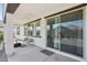 Cozy covered patio with a seating area and seamless access to indoor living through a sliding glass door at 22964 E Via Del Sol --, Queen Creek, AZ 85142
