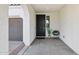 Welcoming front entryway featuring a black front door, textured walls, and a cozy sitting area with a small chair at 22964 E Via Del Sol --, Queen Creek, AZ 85142