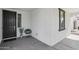 Inviting front entrance with a dark front door, a small accent chair, and a modern, minimalist design at 22964 E Via Del Sol --, Queen Creek, AZ 85142