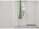 Well-lit hallway showcasing a front door with a sidelight window at 22964 E Via Del Sol --, Queen Creek, AZ 85142