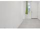 Hallway with bright white trim, door with sidelight, and tile flooring at 22964 E Via Del Sol --, Queen Creek, AZ 85142