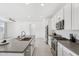 Open kitchen featuring stainless steel appliances, center island, and modern fixtures at 22964 E Via Del Sol --, Queen Creek, AZ 85142