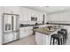 Well-lit kitchen with stainless steel appliances, gray countertops and a center island at 22964 E Via Del Sol --, Queen Creek, AZ 85142