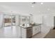 Bright and airy kitchen island featuring stainless steel appliances, white cabinetry, and an open view to the backyard at 22964 E Via Del Sol --, Queen Creek, AZ 85142