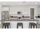 Kitchen featuring an island with bar seating, stainless appliances, and neutral countertops at 22964 E Via Del Sol --, Queen Creek, AZ 85142
